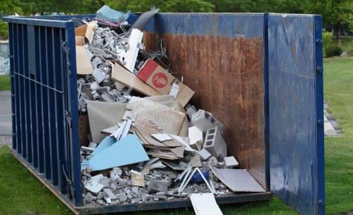 Professional office clearance team removing furniture